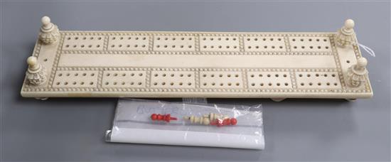 An ivory cribbage board